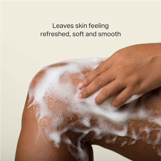 product A woman's soapy leg and hand. Caption: Leaves skin feeling refreshed, soft and smooth
