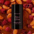 product after glow natural fragrance aluminum free deodorant on a bed of raspberries and mandarin oranges