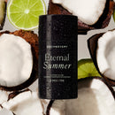 eternal summer (coconut & lime) natural fragrance aluminum free deodorant sitting atop a bed of coconuts and limes