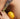 zoomed in image of bare skinned model holding lavender sprigs and a lemon