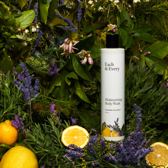 product with lavender plants and lemons in background